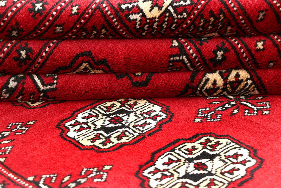 Red Pakistani Bokhara Rug 4' 1" x 6' 1" Hand-Knotted | No. QA49265