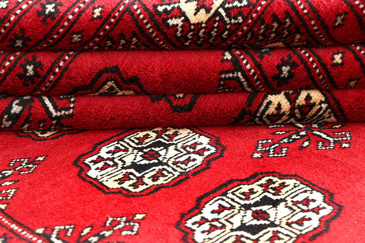 Red Pakistani Bokhara Rug 4' 1" x 6' 1" Hand-Knotted | No. QA49265
