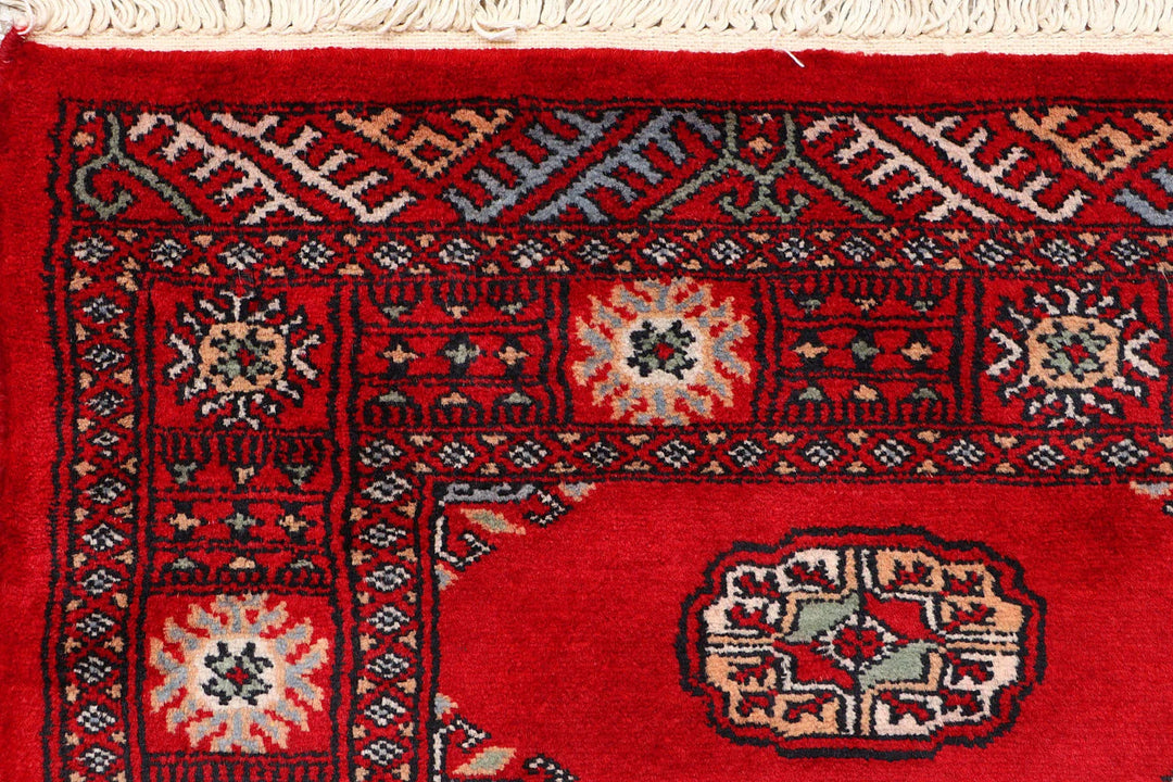 Red Pakistani Bokhara Rug 2' 5" x 9' 7" Hand-Knotted | No. QA49926