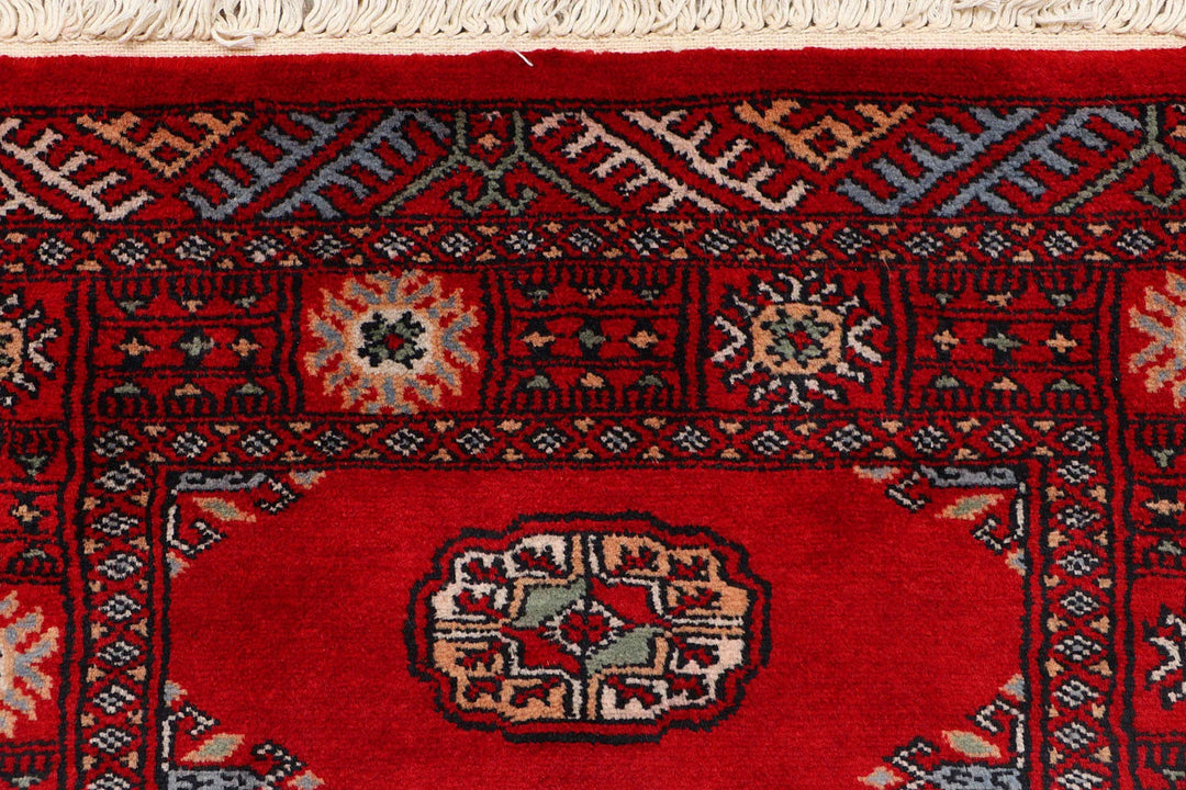 Red Pakistani Bokhara Rug 2' 5" x 9' 7" Hand-Knotted | No. QA49926