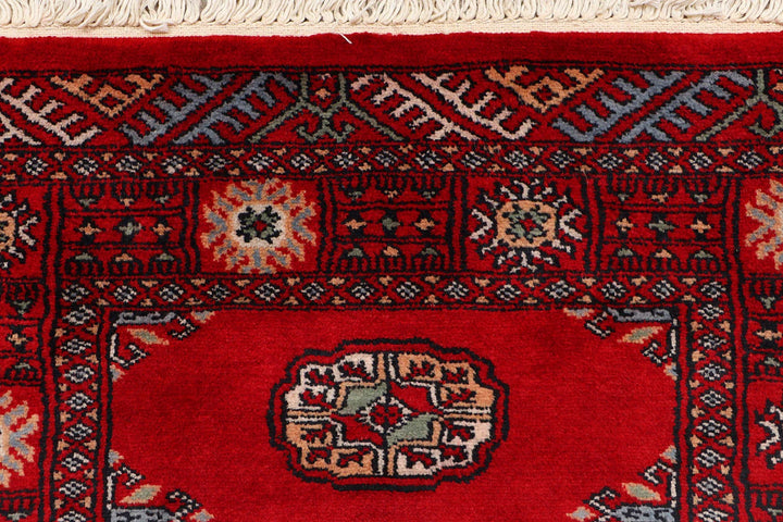 Red Pakistani Bokhara Rug 2' 5" x 9' 7" Hand-Knotted | No. QA49926