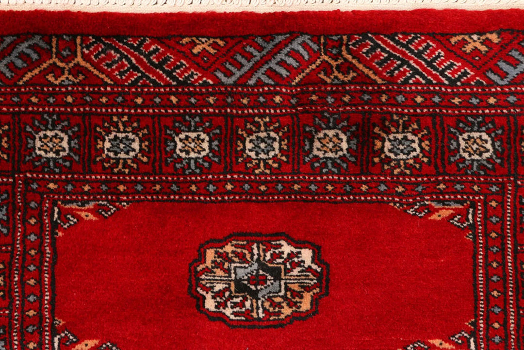 Red Pakistani Bokhara Rug 2' 6" x 9' 2" Hand-Knotted | No. QA50265