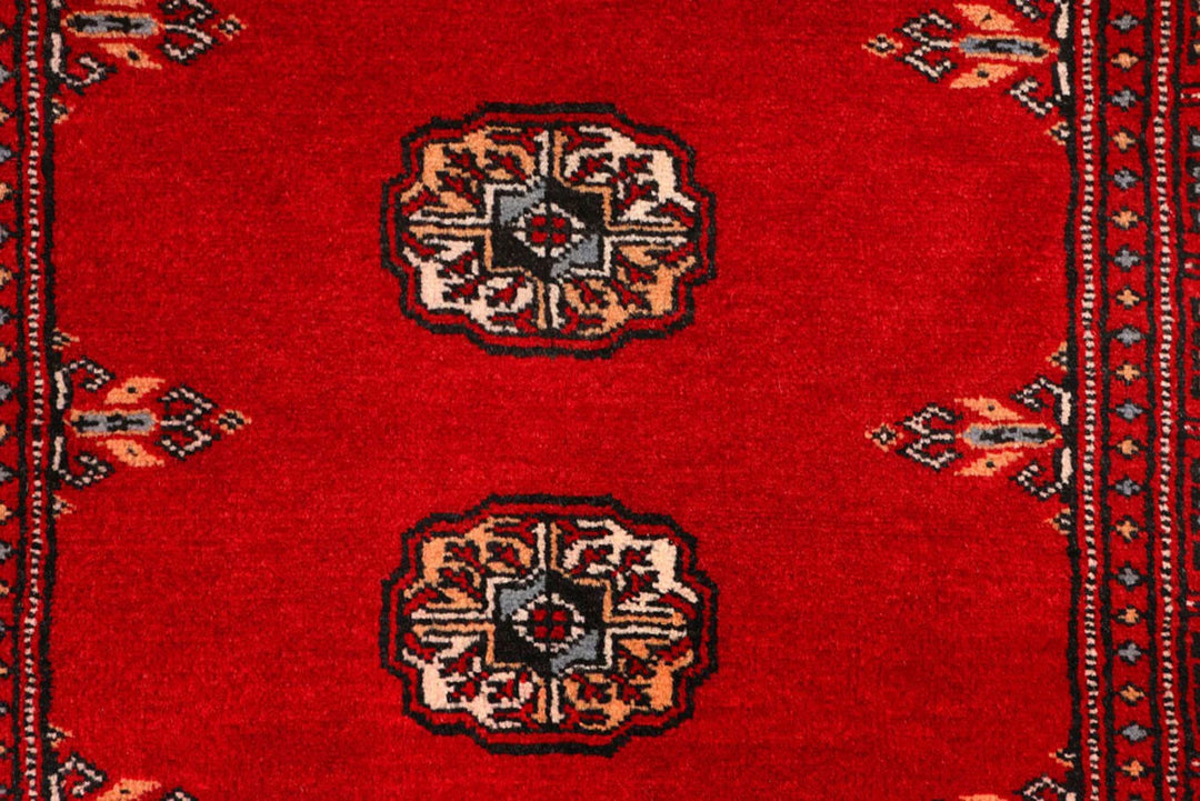 Red Pakistani Bokhara Rug 2' 6" x 9' 2" Hand-Knotted | No. QA50265