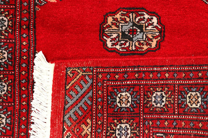 Red Pakistani Bokhara Rug 2' 6" x 9' 2" Hand-Knotted | No. QA50265