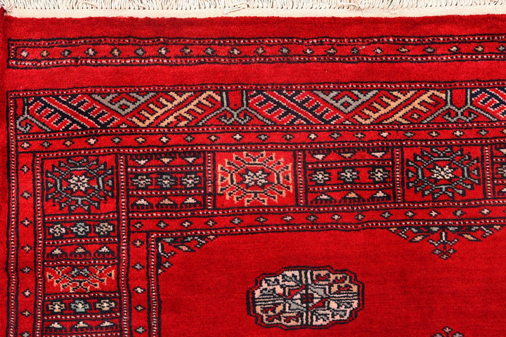 Red Pakistani Bokhara Rug 4' 1" x 6' 4" Hand-Knotted | No. QA50879
