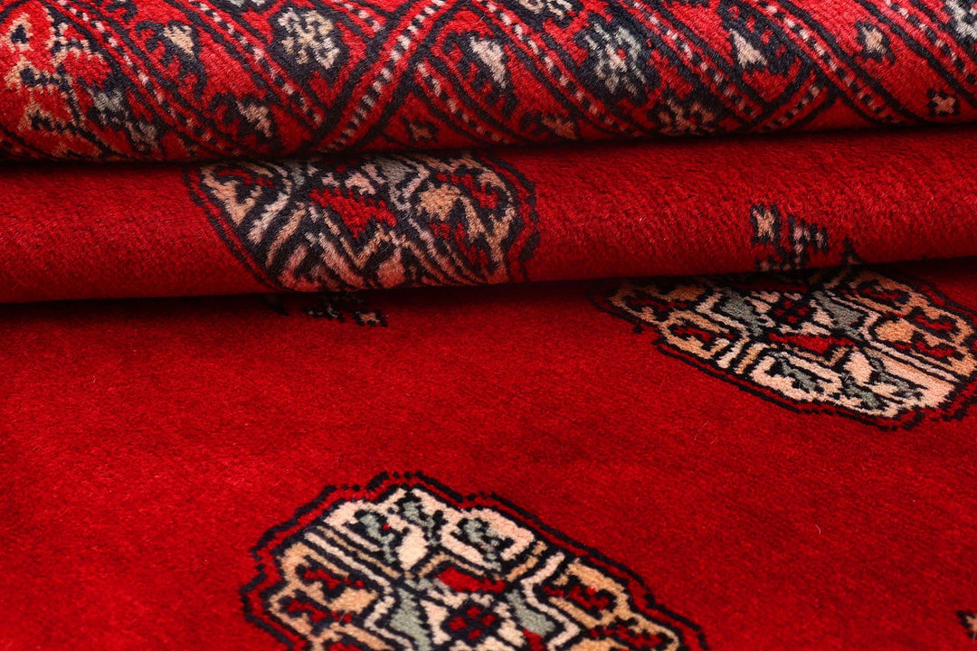 Red Pakistani Bokhara Rug 4' 1" x 6' 4" Hand-Knotted | No. QA50879