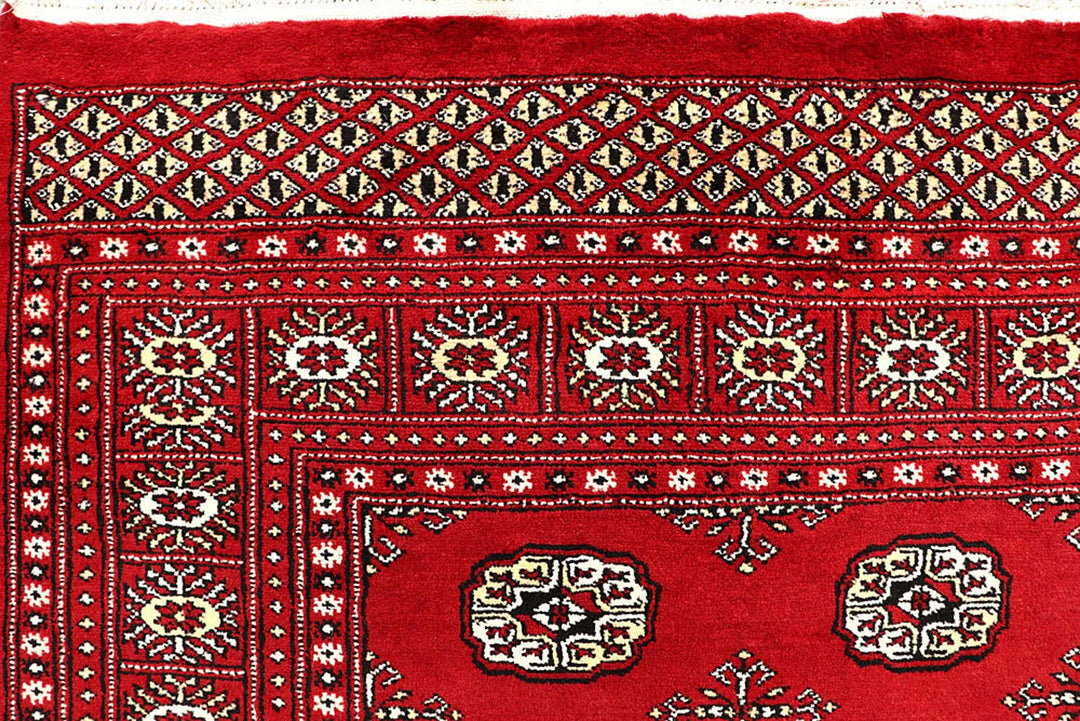 Red Pakistani Bokhara Rug 6' 1" x 9' 1" Hand-Knotted | No. QA53301