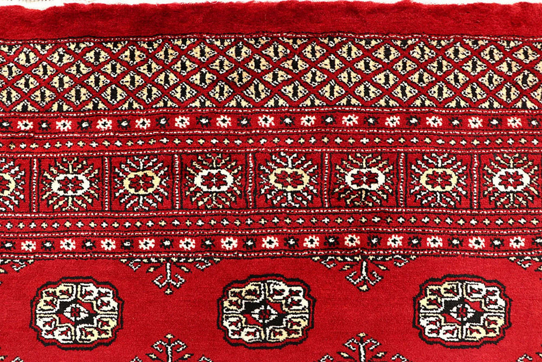 Red Pakistani Bokhara Rug 6' 1" x 9' 1" Hand-Knotted | No. QA53301