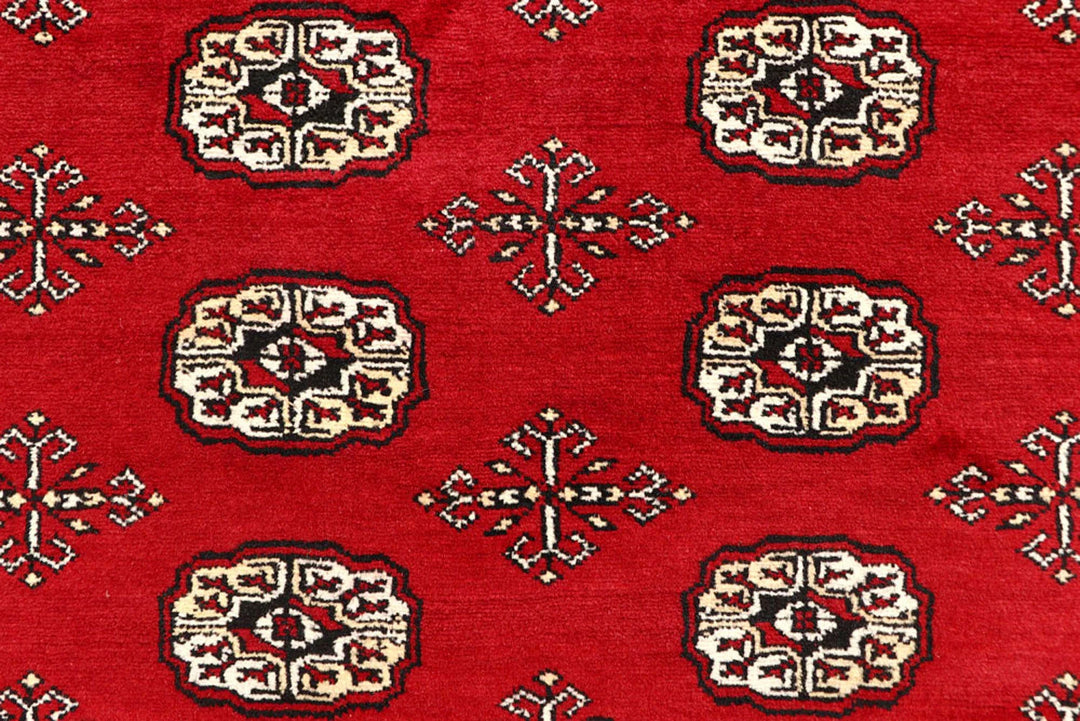 Red Pakistani Bokhara Rug 6' 1" x 9' 1" Hand-Knotted | No. QA53301