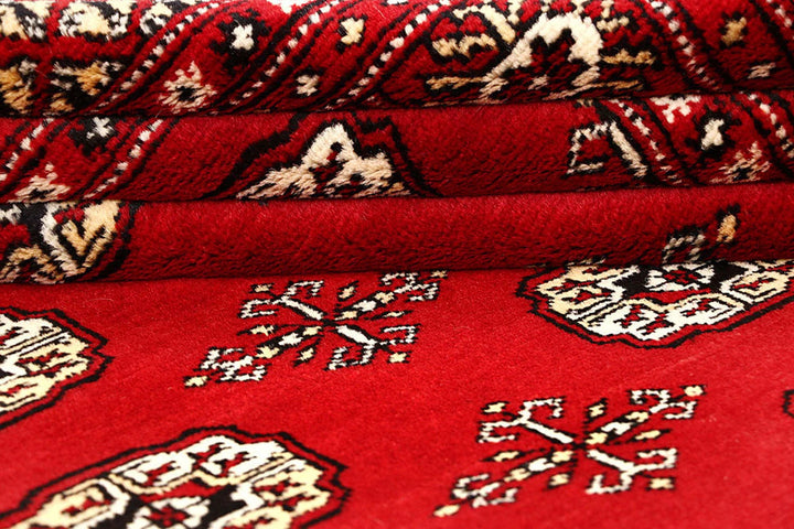 Red Pakistani Bokhara Rug 6' 1" x 9' 1" Hand-Knotted | No. QA53301