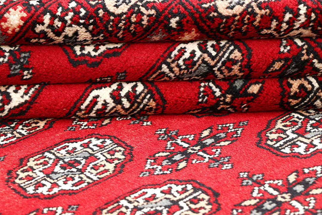 Red Pakistani Bokhara Rug 4' 4" x 6' 6" Hand-Knotted | No. QA53781