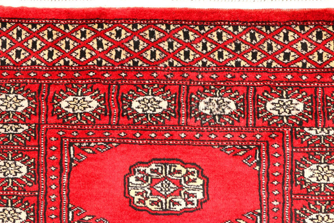 Red Pakistani Bokhara Rug 2' 6" x 9' 1" Hand-Knotted | No. QA54159