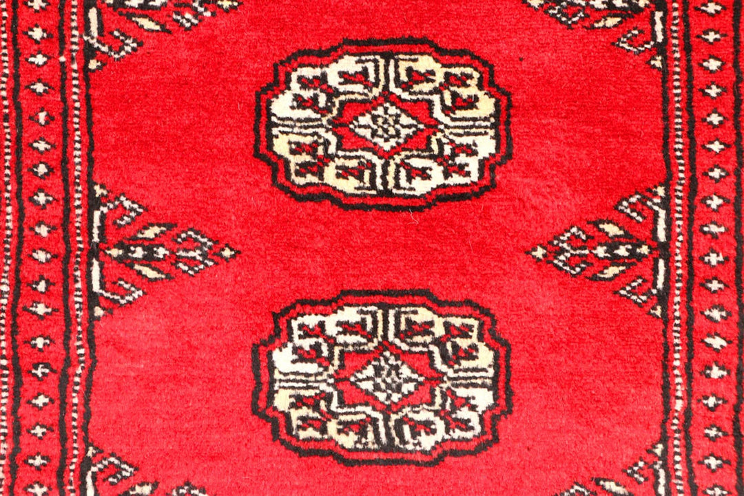 Red Pakistani Bokhara Rug 2' 6" x 9' 1" Hand-Knotted | No. QA54159