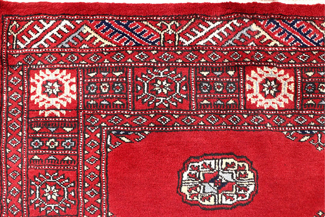 Red Pakistani Bokhara Rug 4' 2" x 6' 5" Hand-Knotted | No. QA54370