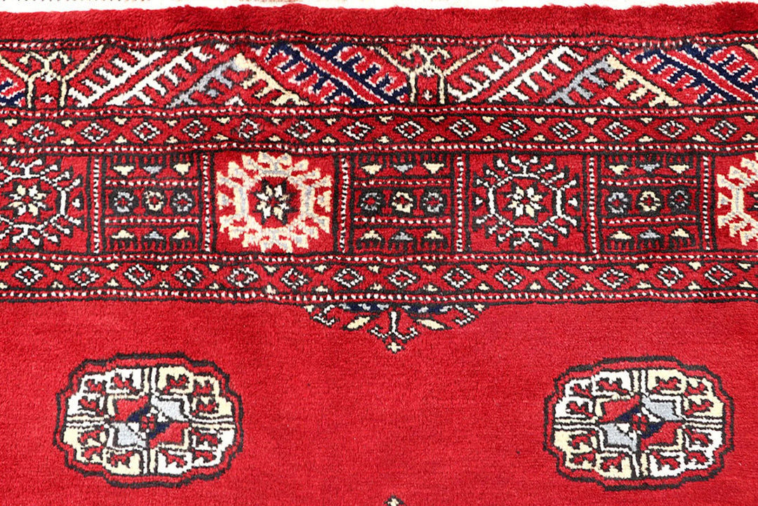 Red Pakistani Bokhara Rug 4' 2" x 6' 5" Hand-Knotted | No. QA54370