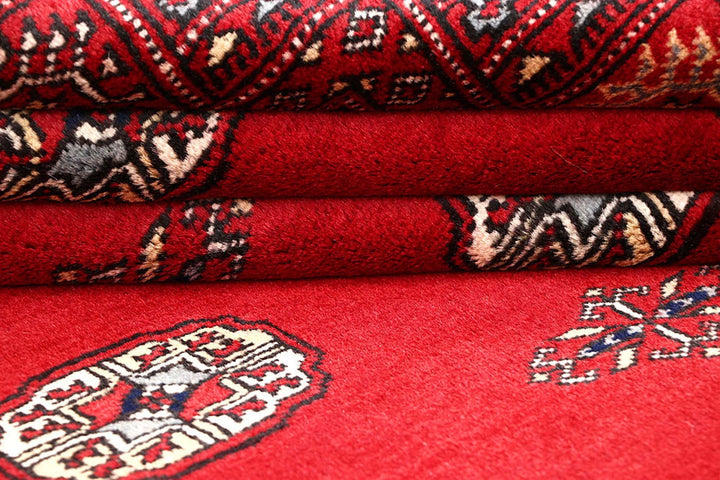 Red Pakistani Bokhara Rug 4' 2" x 6' 5" Hand-Knotted | No. QA54370