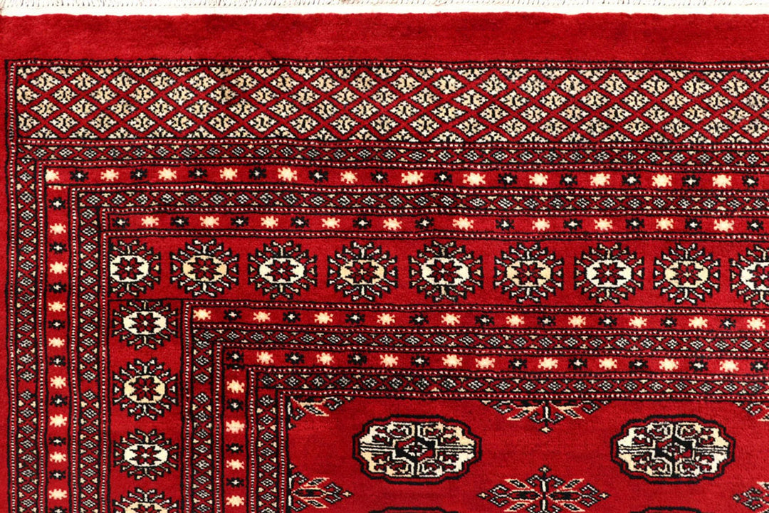 Firebrick Pakistani Bokhara Rug 8' 1" x 10' 3" Hand-Knotted | No. QA54582