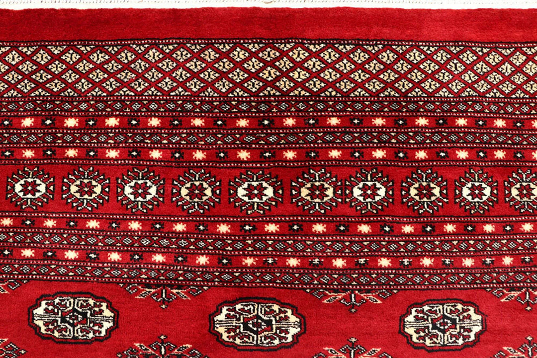 Firebrick Pakistani Bokhara Rug 8' 1" x 10' 3" Hand-Knotted | No. QA54582