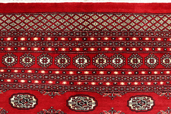 Firebrick Pakistani Bokhara Rug 8' 1" x 10' 3" Hand-Knotted | No. QA54582
