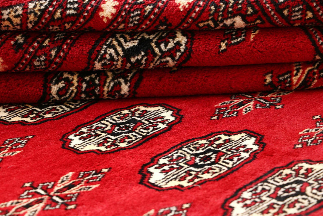 Firebrick Pakistani Bokhara Rug 8' 1" x 10' 3" Hand-Knotted | No. QA54582