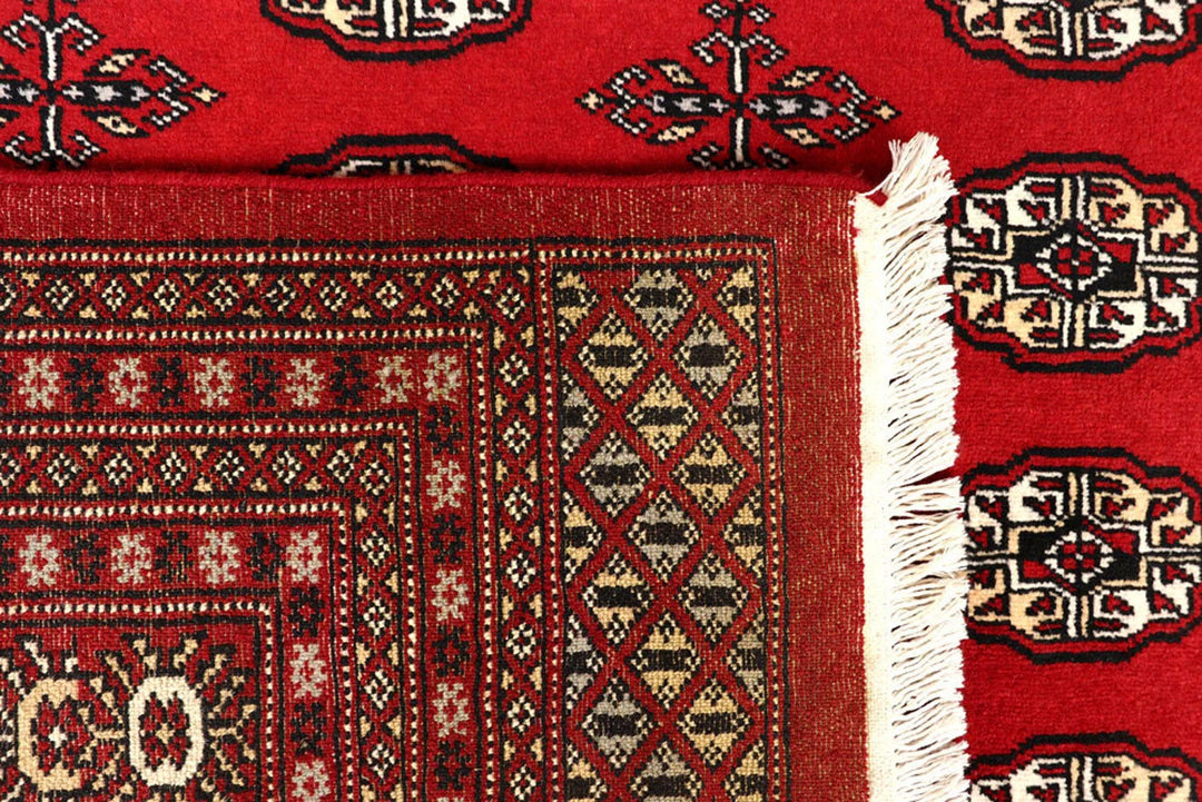 Red Pakistani Bokhara Rug 8' 1" x 10' 6" Hand-Knotted | No. QA54953