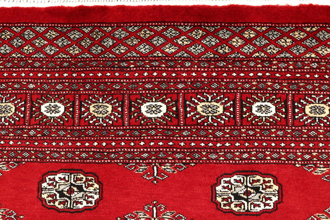 Red Pakistani Bokhara Rug 6' 2" x 8' 6" Hand-Knotted | No. QA55142
