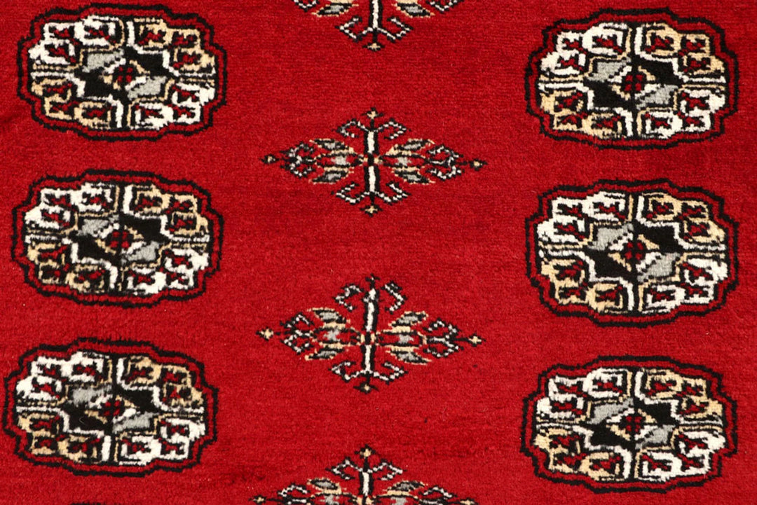 Red Pakistani Bokhara Rug 6' 2" x 8' 6" Hand-Knotted | No. QA55142