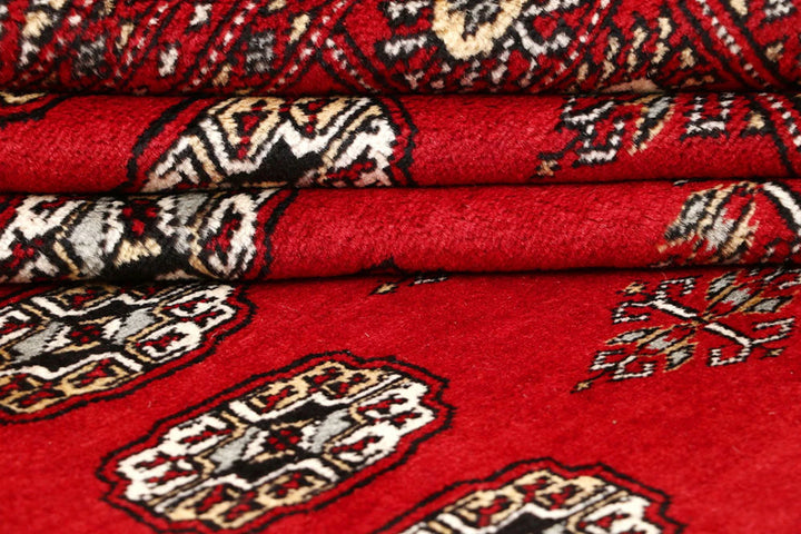 Red Pakistani Bokhara Rug 6' 2" x 8' 6" Hand-Knotted | No. QA55142