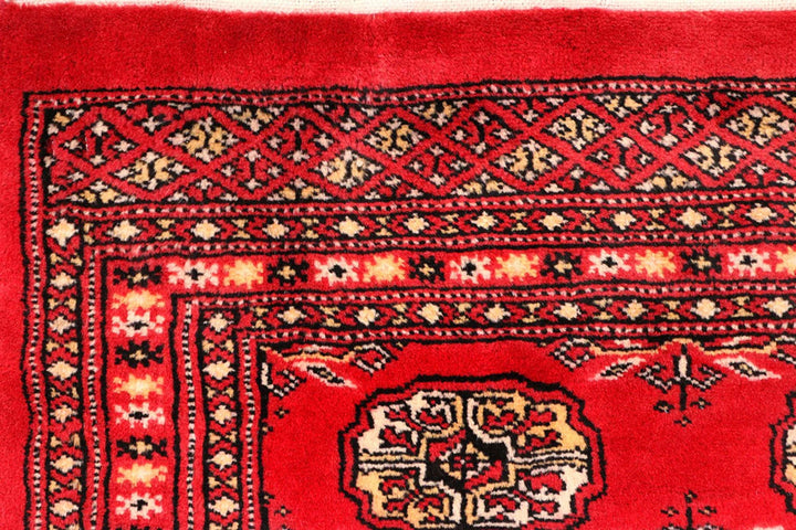 Red Pakistani Bokhara Rug 2' 6" x 10' 4" Hand-Knotted | No. QA55234