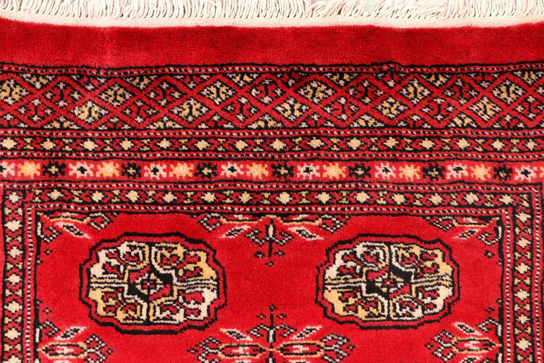 Red Pakistani Bokhara Rug 2' 6" x 10' 4" Hand-Knotted | No. QA55234