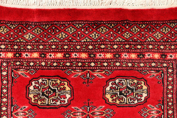 Red Pakistani Bokhara Rug 2' 6" x 10' 4" Hand-Knotted | No. QA55234