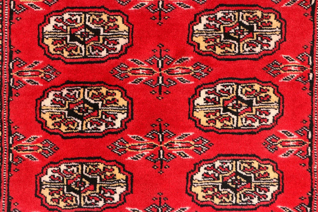 Red Pakistani Bokhara Rug 2' 6" x 10' 4" Hand-Knotted | No. QA55234