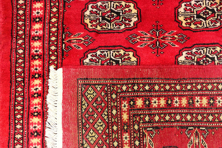 Red Pakistani Bokhara Rug 2' 6" x 10' 4" Hand-Knotted | No. QA55234