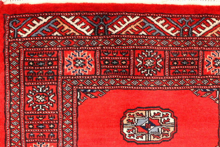 Red Pakistani Bokhara Rug 2' 7" x 11' 9" Hand-Knotted | No. QA55512