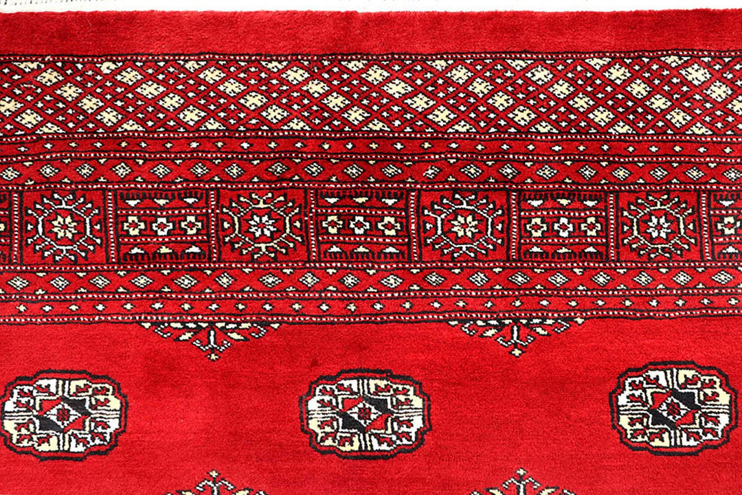 Red Pakistani Bokhara Rug 6' 2" x 9' 8" Hand-Knotted | No. QA55625