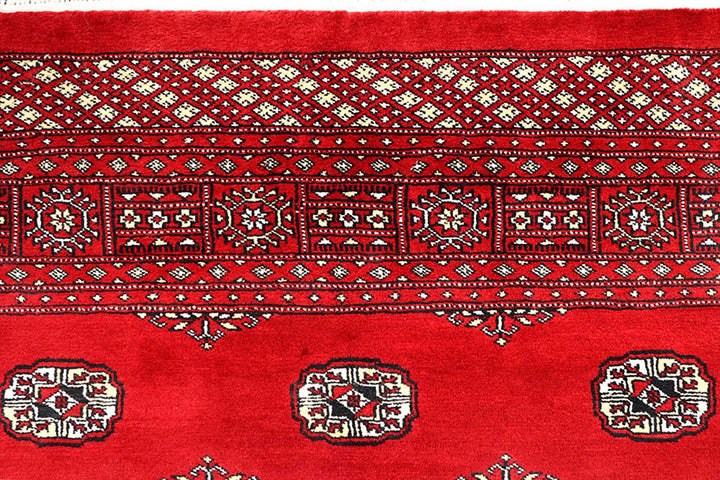 Red Pakistani Bokhara Rug 6' 2" x 9' 8" Hand-Knotted | No. QA55625