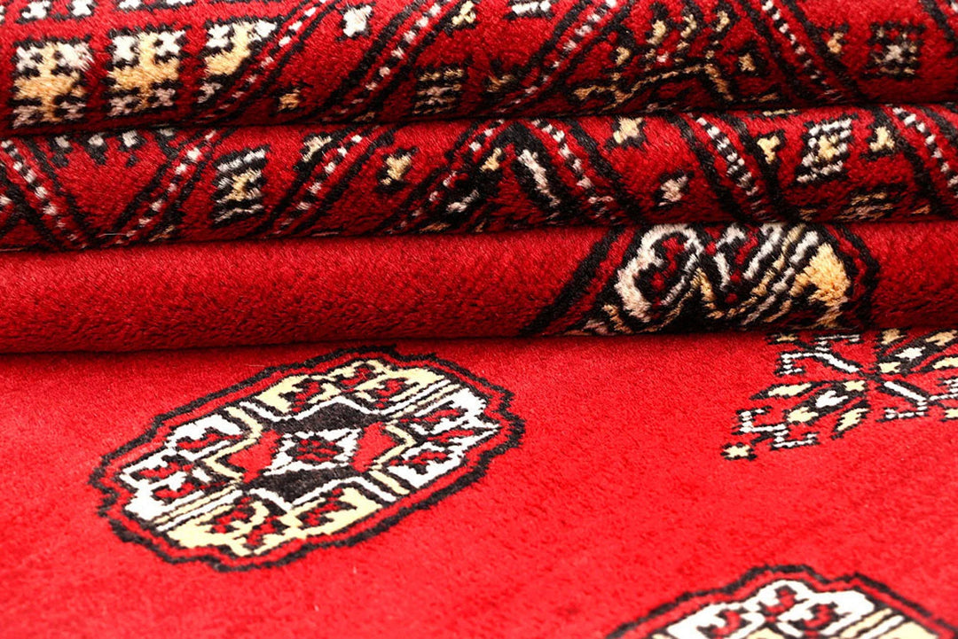 Red Pakistani Bokhara Rug 6' 2" x 9' 8" Hand-Knotted | No. QA55625