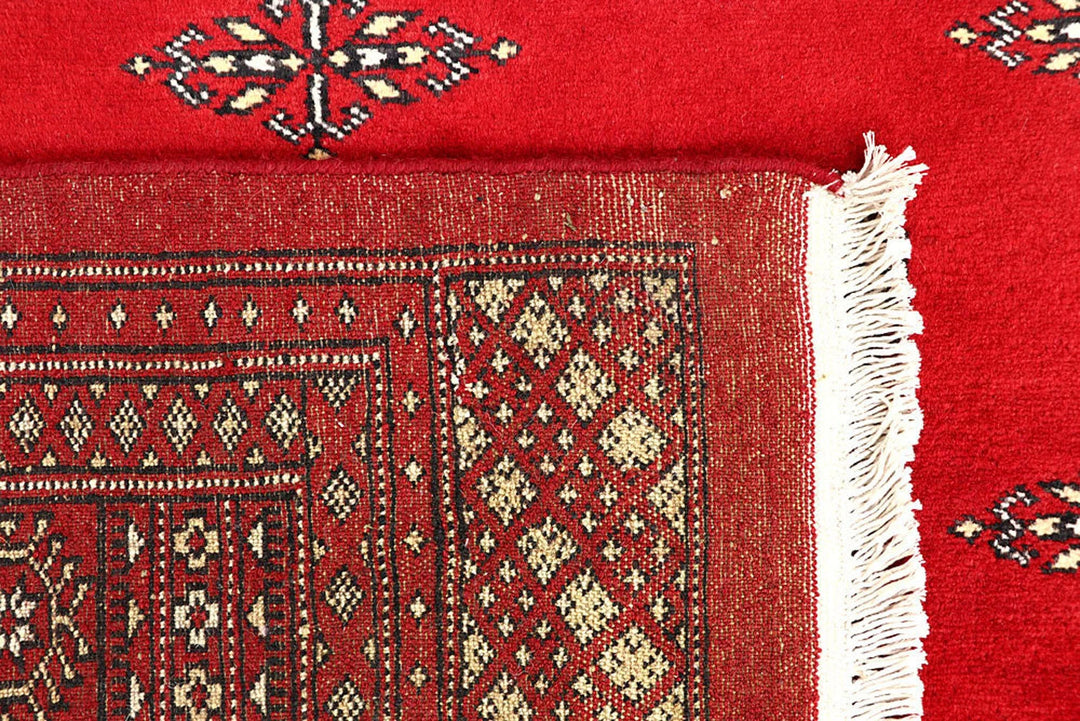 Red Pakistani Bokhara Rug 6' 2" x 9' 8" Hand-Knotted | No. QA55625