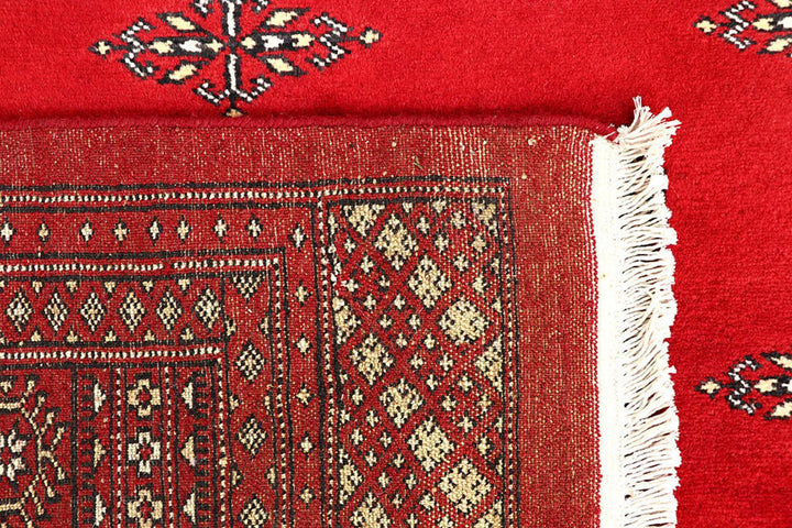Red Pakistani Bokhara Rug 6' 2" x 9' 8" Hand-Knotted | No. QA55625