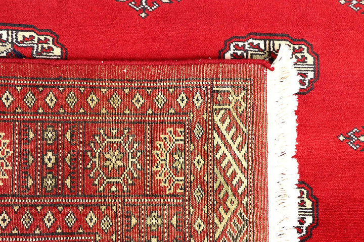 Red Pakistani Bokhara Rug 4' 1" x 6' 3" Hand-Knotted | No. QA55639