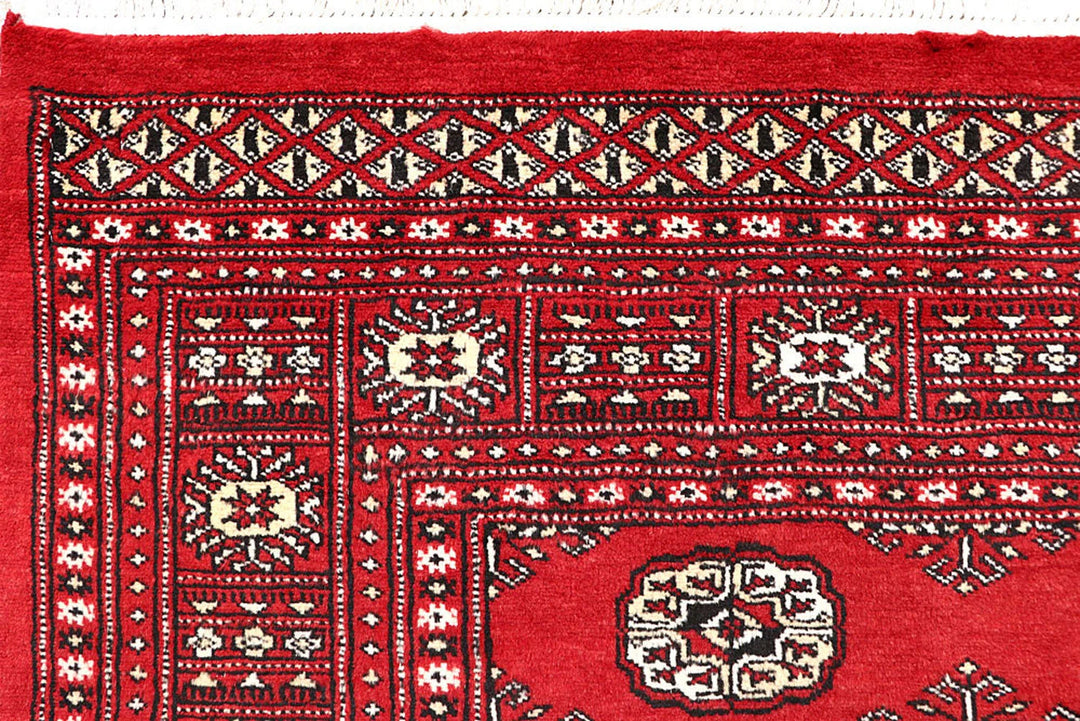 Firebrick Pakistani Bokhara Rug 4' 11" x 7' 9" Hand-Knotted | No. QA55857