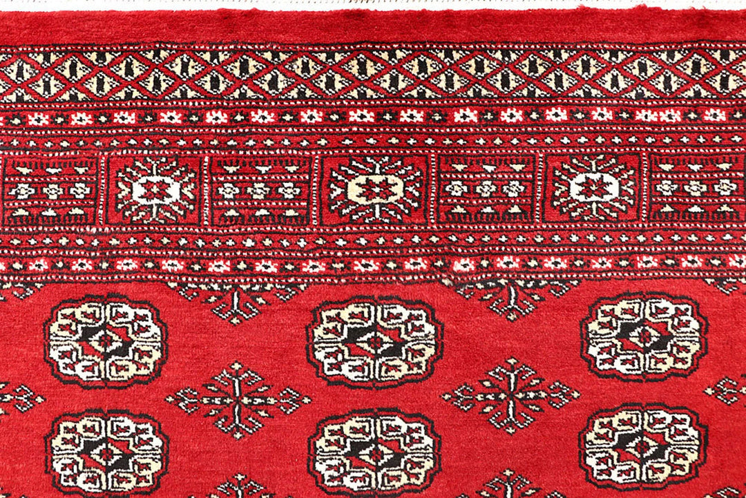 Firebrick Pakistani Bokhara Rug 4' 11" x 7' 9" Hand-Knotted | No. QA55857