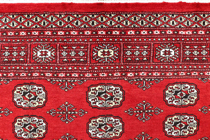 Firebrick Pakistani Bokhara Rug 4' 11" x 7' 9" Hand-Knotted | No. QA55857