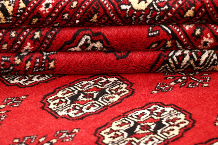 Firebrick Pakistani Bokhara Rug 4' 11" x 7' 9" Hand-Knotted | No. QA55857