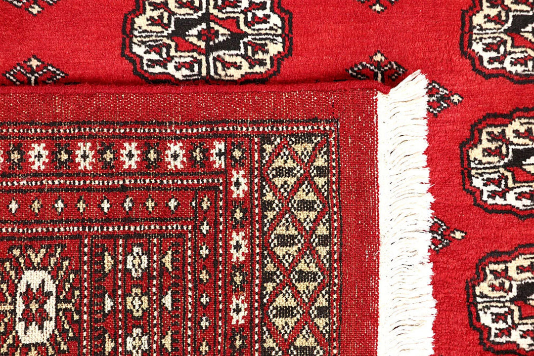 Firebrick Pakistani Bokhara Rug 4' 11" x 7' 9" Hand-Knotted | No. QA55857