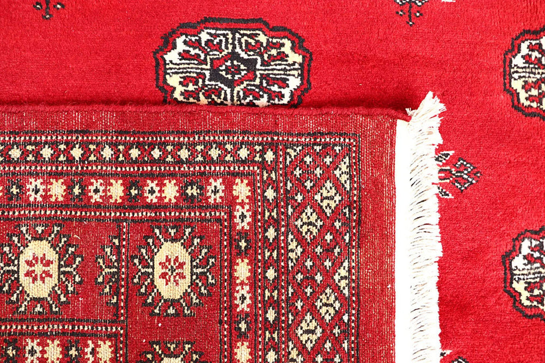 Red Pakistani Bokhara Rug 5' 7" x 8' 10" Hand-Knotted | No. QA56012