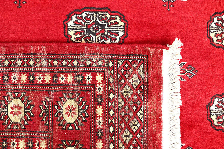 Red Pakistani Bokhara Rug 5' 7" x 8' 10" Hand-Knotted | No. QA56012