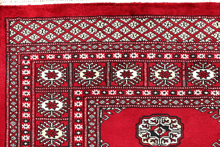 Red Pakistani Bokhara Rug 4' 5" x 6' 3" Hand-Knotted | No. QA56380
