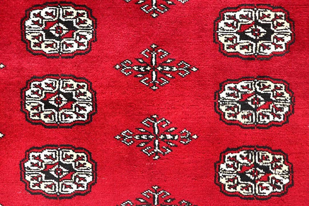 Red Pakistani Bokhara Rug 4' 5" x 6' 3" Hand-Knotted | No. QA56380