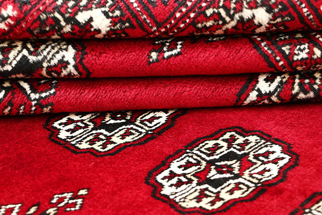 Red Pakistani Bokhara Rug 4' 5" x 6' 3" Hand-Knotted | No. QA56380